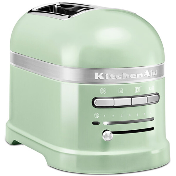 KitchenAid 5KMT2204EPT Toaster 2-Scheiben ARTISAN Farbe pistazie incl. Sandwichzange - Der Toaster in einer spezifischen Farbe, abgebildet auf einer modernen K&uuml;chenarbeitsplatte.